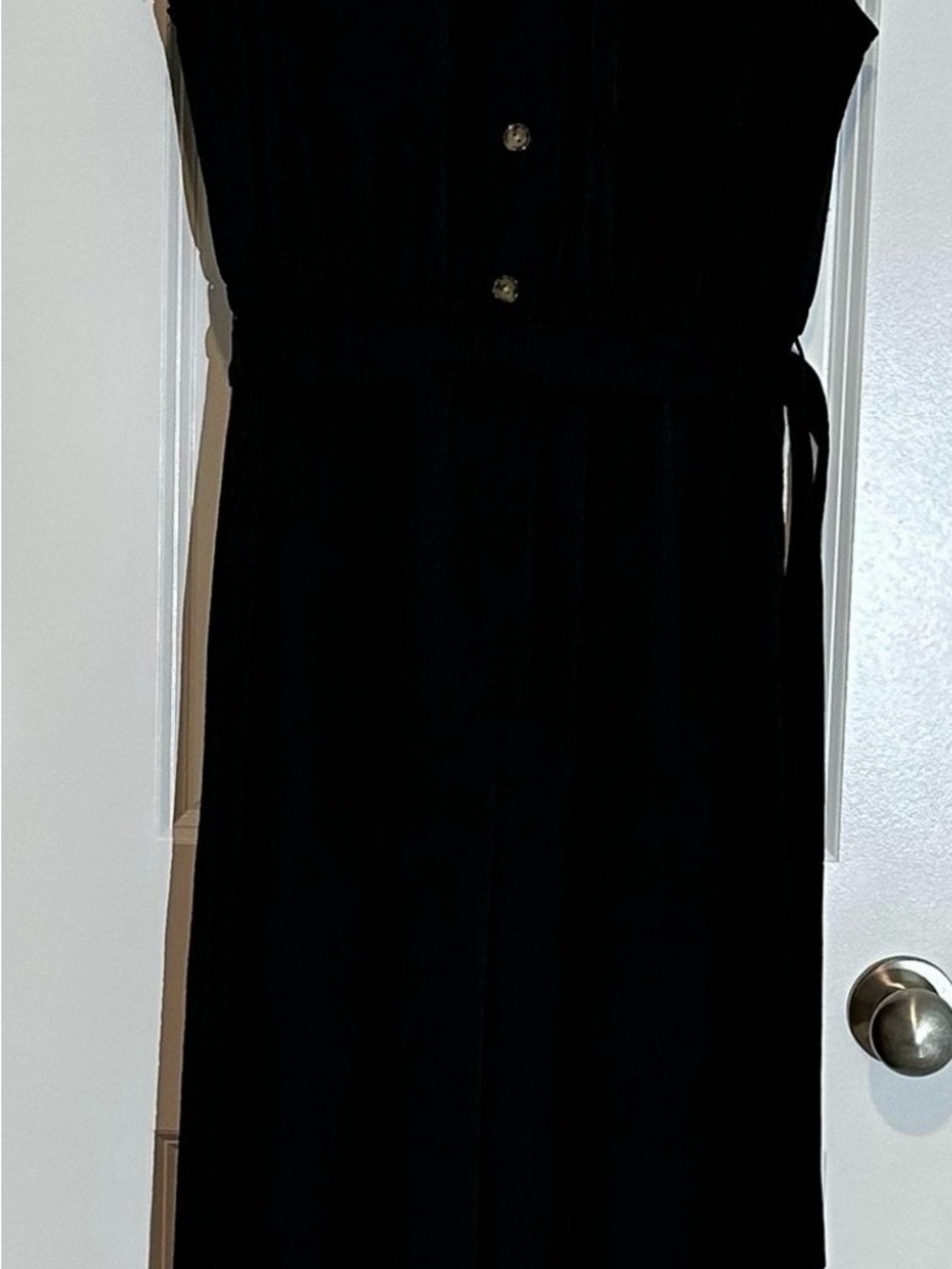 Classic black jumpsuits and rompers: a timeless feminine garment.